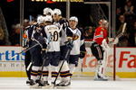 CHICAGO - FEBRUARY 13: Members of the Atlanta Thrashers including (L-R) Tobias Enstrom #39, Bryan Little #10 and Pavel Kubina #77 celebrate a goal against Antti Niemi #31 of the Chicago Blackhawks at the United Center on February 13, 2010 in Chicago, Illinois. (Photo by Jonathan Daniel/Getty Images)