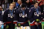 VANCOUVER, BC - FEBRUARY 28:  Dejected Team USA players look on after receiving the silver medal won during the ice hockey men's gold medal game between USA and Canada on day 17 of the Vancouver 2010 Winter Olympics at Canada Hockey Place on February 28, 2010 in Vancouver, Canada.  (Photo by Bruce Bennett/Getty Images)
