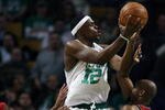 BOSTON - JANUARY 14:  Bill Walker #12 of the Boston Celtics takes a shot over Trenton Hassell #44 of the New Jersey Nets at TD Banknorth Garden January 14, 2009 in Boston, Massachusetts. The Celtics defeated the Nets 118-86. NOTE TO USER: User expressly acknowledges and agrees that, by downloading and or using this Photograph, user is consenting to the terms and conditions of the Getty Images License Agreement.  (Photo by Elsa/Getty Images)