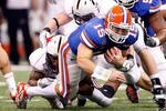 NEW ORLEANS - JANUARY 01:  Quarterback Tim Tebow #15 of the Florida Gators runs for a first down on 4th downs against the Cincinnati Bearcats during the Allstate Sugar Bowl at the Louisana Superdome on January 1, 2010 in New Orleans, Louisiana.  (Photo by Kevin C. Cox/Getty Images)