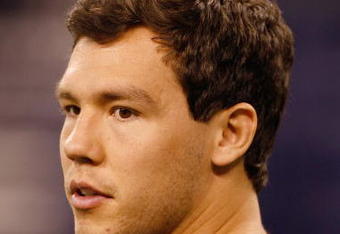 INDIANAPOLIS, IN - FEBRUARY 28: Quarterback Sam Bradford of Oklahoma watches drills after deciding not to participate  during the NFL Scouting Combine presented by Under Armour at Lucas Oil Stadium on February 28, 2010 in Indianapolis, Indiana. (Photo by Scott Boehm/Getty Images)
