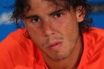 MELBOURNE, AUSTRALIA - JANUARY 26:  Rafael Nadal of Spain talks to the media at a press conference after retiring from his quarterfinal match against Andy Murray of Great Britain during day nine of the 2010 Australian Open at Melbourne Park on January 26, 2010 in Melbourne, Australia.  (Photo by Ryan Pierse/Getty Images)