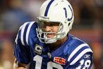 MIAMI GARDENS, FL - FEBRUARY 07:  Quarterback Peyton Manning #18 of the Indianapolis Colts hands off the ball against the New Orleans Saints during Super Bowl XLIV on February 7, 2010 at Sun Life Stadium in Miami Gardens, Florida.  (Photo by Andy Lyons/Getty Images)