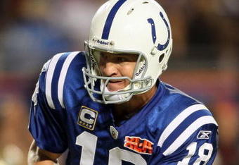 MIAMI GARDENS, FL - FEBRUARY 07:  Quarterback Peyton Manning #18 of the Indianapolis Colts hands off the ball against the New Orleans Saints during Super Bowl XLIV on February 7, 2010 at Sun Life Stadium in Miami Gardens, Florida.  (Photo by Andy Lyons/Getty Images)