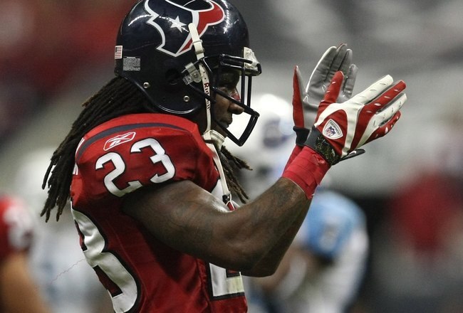 HOUSTON - NOVEMBER 23:  Cornerback Dunta Robinson #23 of the Houston Texans celebrates in the game against the Tennessee Titans on November 23, 2009  at Reliant Stadium in Houston, Texas.  The Titans won 20-17.  (Photo by Stephen Dunn/Getty Images)