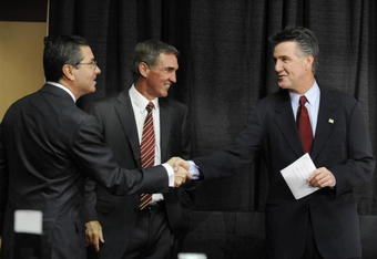 ASHBURN,VA - JANUARY 6:  Dan Snyder, owner of the Washington Redskins, Mike Shanahan the new Executive Vice President and head coach, and Bruce Allen Executive Vice President,  before a press conference welcoming Shanahan to the Redskins on January 6, 2010 at Redskins Park in Ashburn, Virginia.  (Photo by Mitchell Layton/Getty Images)