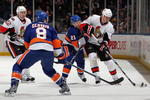 UNIONDALE, NY - FEBRUARY 14:  Filip Kuba #17 of the Ottawa Senators skates against Kyle Okposo #21 of the New York Islanders on February 14, 2010 at Nassau Coliseum in Uniondale, New York.  (Photo by Jim McIsaac/Getty Images)
