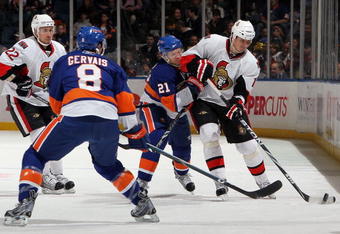 UNIONDALE, NY - FEBRUARY 14:  Filip Kuba #17 of the Ottawa Senators skates against Kyle Okposo #21 of the New York Islanders on February 14, 2010 at Nassau Coliseum in Uniondale, New York.  (Photo by Jim McIsaac/Getty Images)