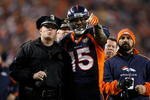 DENVER - DECEMBER 20:  Brandon Marshall #15 of the Denver Broncos points out a disturbance in the crowd to a police officer in the second half against the Oakland Raiders at Invesco Field at Mile High on December 20, 2009 in Denver, Colorado. The Raiders defeated the Broncos 20-19.  (Photo by Jeff Gross/Getty Images)
