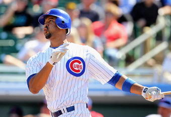 MESA, AZ - MARCH 04:  Derrek Lee #25 of the Chicago Cubs hits a solo home run against the Oakland Athletics during the first inning of the MLB spring training game at HoHoKam Park on March 4, 2009 in Mesa, Arizona  (Photo by Christian Petersen/Getty Images)