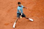 PARIS - JUNE 07:  Roger Federer of Switzerland hits a forehand during the Men's Singles Final match against Robin Soderling of Sweden on day fifteen of the French Open at Roland Garros on June 7, 2009 in Paris, France.  (Photo by Matthew Stockman/Getty Images)