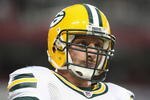 GLENDALE, AZ - AUGUST 28:  Linebacker Aaron Kampman #74 of the Green Bay Packers warms up before the NFL game against the Arizona Cardinals at the University of Phoenix Stadium on August 28, 2009 in Glendale, Arizona. The Packers defeated the Cardinals 44-37.  (Photo by Christian Petersen/Getty Images)