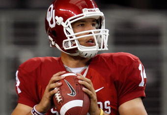 ARLINGTON, TX - SEPTEMBER 05:  Quarterback Sam Bradford #14 of the Oklahoma Sooners warms up before a game against the Brigham Young Cougars at Cowboys Stadium on September 5, 2009 in Arlington, Texas.  (Photo by Ronald Martinez/Getty Images)