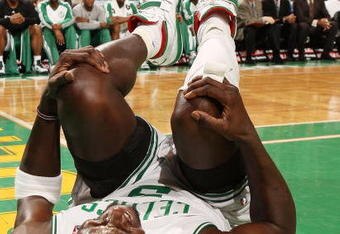 BOSTON - FEBRUARY 27:  Kevin Garnett #5 of the Boston Celtics grabs his knee after he falls in the second half against the New Jersey Nets at the TD Garden on February 27, 2010 in Boston, Massachusetts. Garnett continued to play the rest of the game. The Nets defeated the Celtics 104-96.  NOTE TO USER: User expressly acknowledges and agrees that, by downloading and or using this photograph, User is consenting to the terms and conditions of the Getty Images License Agreement.  (Photo by Elsa/Getty Images)