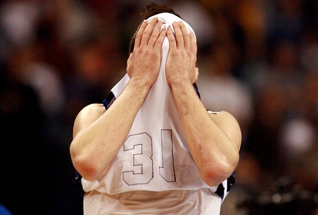 TAMPA, FL - MARCH 21:  Jonathan Cox #31 of the Drake Bulldogs walks off the court after his team lost in overtime to the Western Kentucky Hilltoppers during the first round of the 2008 NCAA Tournament West Regional at the St. Pete Times Forum on March 21, 2008 in Tampa, Florida.  (Photo by Doug Benc/Getty Images)