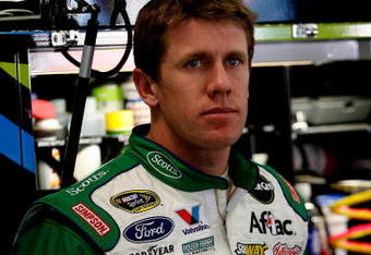 ATLANTA - MARCH 05:  Carl Edwards, driver of the #99 Scotts Ford, stands in the garage during practice for the NASCAR Sprint Cup Series Kobalt Tools 500 at Atlanta Motor Speedway on March 5, 2010 in Hampton, Georgia.  (Photo by Tom Whitmore/Getty Images for NASCAR)