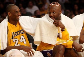 LOS ANGELES, CA - JANUARY 15:  (L-R) Kobe Bryant #24 and Lamar Odom #7 of the Los Angeles Lakers share a laugh on the bench during the game against the Los Angeles Clippers on January 15, 2010 at Staples Center in Los Angeles, California. The Lakers won 126-86. NOTE TO USER: User expressly acknowledges and agrees that, by downloading and/or using this Photograph, user is consenting to the terms and conditions of the Getty Images License Agreement.  (Photo by Stephen Dunn/Getty Images)