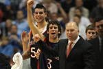 ANAHEIM, CA - DECEMBER 8: Carlin Hughes #3 and Omar Samhan #50 of the Saint Mary's College Gaels celebrate a 69-64 win along with Head Coach Randy Bennett over the San Diego State Aztecs during the second half for the John Wooden Classic at the Honda Center December 8, 2007 in Anaheim, California.  (Photo by Harry How/Getty Images)