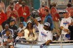 MIAMI GARDENS, FL - FEBRUARY 04:  Bob Sanders #21 of  the Indianapolis Colts celebrates with the Vince Lombardi Trophy, next to head coach Tony Dungy and his wife Lauren Dungy, after the Colts 29-17 win against the Chicago Bears in Super Bowl XLI on February 4, 2007 at Dolphin Stadium in Miami Gardens, Florida.  (Photo by Eliot J. Schechter/Getty Images)