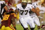 LOS ANGELES - SEPTEMBER 1:  Idaho guard Mike Iupati #77 leads block against USC at the Los Angeles Memorial Coliseum on September 1, 2007 in Los Angeles, California. The Vandals were defeated by the top-ranked Trojans won 38-10. (Photo by Kevin Terrell/Getty Images)