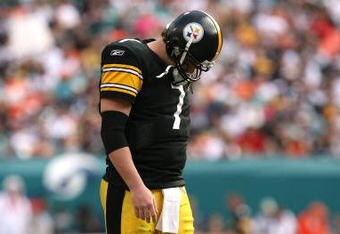 MIAMI - JANUARY 03:  Quarterback Ben Roethlisberger #7 of the Pittsburgh Steelers walks back to the huddle after injuring his shoulder in the fourth quarter against the Miami Dolphins at Land Shark Stadium on January 3, 2010 in Miami, Florida. The Steelers defeated the Dolphins 30-24.  (Photo by Doug Benc/Getty Images)