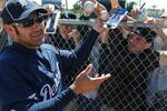 DUNEDIN, FL - MARCH 7: Designated hitter Johnny Damon #18 of the Detroit Tigers signs autographs before the game against the Toronto Blue Jays March 7, 2010 at Dunedin Stadium in Dunedin, Florida. (Photo by Al Messerschmidt/Getty Images) 