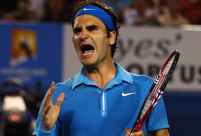 MELBOURNE, AUSTRALIA - JANUARY 31:  Roger Federer of Switzerland reacts after a point in his men's final match against Andy Murray of Great Britain during day fourteen of the 2010 Australian Open at Melbourne Park on January 31, 2010 in Melbourne, Australia.  (Photo by Clive Brunskill/Getty Images)
