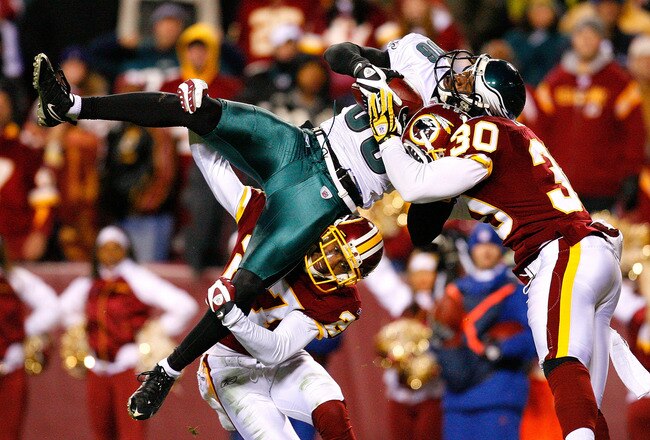 LANDOVER, MD - DECEMBER 21:  Receiver Reggie Brown #86 of the Philadelphia Eagles is stopped just short of the end zone by Fred Smoot #27 and LaRon Landry #30 of the Washington Redskins during the game on December 21, 2008 at FedEx Field in Landover, Maryland.  (Photo by Kevin C. Cox/Getty Images)