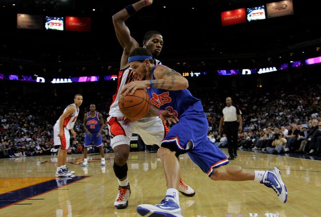 OAKLAND, CA - JANUARY 11:  Delonte West #13 of the Cleveland Cavaliers drives on Cartier Martin #20 of the Golden State Warriors at Oracle Arena on January 11, 2010 in Oakland, California.  NOTE TO USER: User expressly acknowledges and agrees that, by downloading and/or using this Photograph, user is consenting to the terms and conditions of the Getty Images License Agreement.  (Photo by Ezra Shaw/Getty Images)