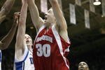 DURHAM, NC - NOVEMBER 27:  Jon Leuer #30 of the Wisconsin Badgers puts the ball up against Kye Singler #12 of the Duke Blue Devils at Cameron Indoor Stadium on November 27, 2007 in Durham, North Carolina.  Duke defeated Wisconsin 82-58. (Photo by: Kevin C. Cox/Getty Images)