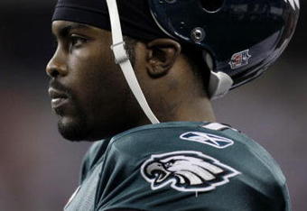 ARLINGTON, TX - JANUARY 9:  Quarterback Michael Vick #7 of the Philadelphia Eagles looks on from the sideline in the second half against the Dallas Cowboys during the 2010 NFC wild-card playoff game at Cowboys Stadium on January 9, 2010 in Arlington, Texas. (Photo by Jamie Squire/Getty Images)