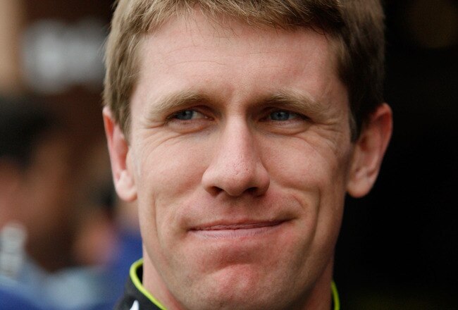 FONTANA, CA - FEBRUARY 19:  Carl Edwards, driver of the #99 Aflac Ford, stands in the garage area during practice for the NASCAR Nationwide Series Stater Bros. 300 at Auto Club Speedway on February 19, 2010 in Fontana, California.  (Photo by Tom Pennington/Getty Images for NASCAR)