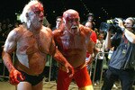 PERTH, AUSTRALIA - NOVEMBER 24:  Hulk Hogan guides Rick Flair back to the ring during the Hulkamania Tour at the Burswood Dome on November 24, 2009 in Perth, Australia.  (Photo by Paul Kane/Getty Images)