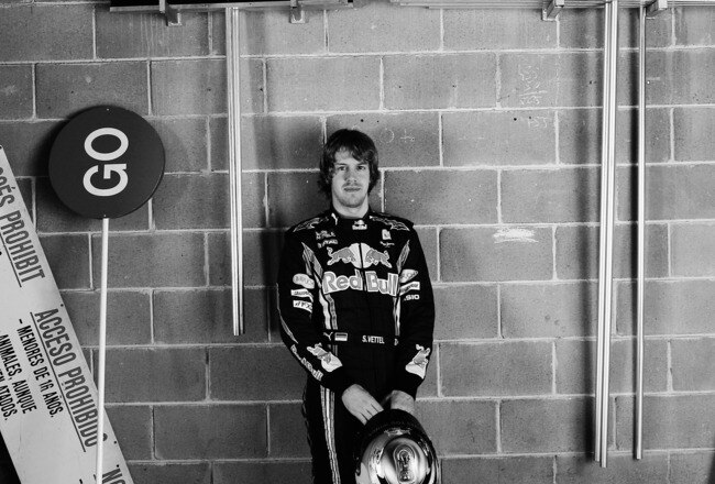 BARCELONA, SPAIN - FEBRUARY 26:  (EDITORS NOTE: THIS BLACK AND WHITE IMAGE WAS CREATED FROM ORIGINAL COLOUR FILE)  Sebastian Vettel of Germany and Red Bull Racing poses for a photograph following Formula One winter testing at the Circuit De Catalunya on February 26, 2010 in Barcelona, Spain.  (Photo by Mark Thompson/Getty Images)