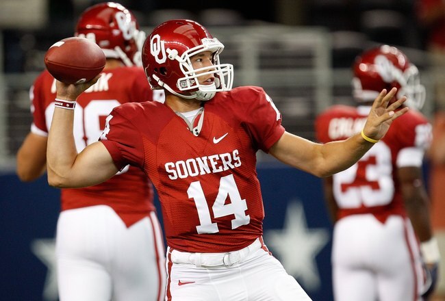 ARLINGTON, TX - SEPTEMBER 05:  Quarterback Sam Bradford #14 of the Oklahoma Sooners warms up before a game against the Brigham Young Cougars at Cowboys Stadium on September 5, 2009 in Arlington, Texas.  (Photo by Ronald Martinez/Getty Images)