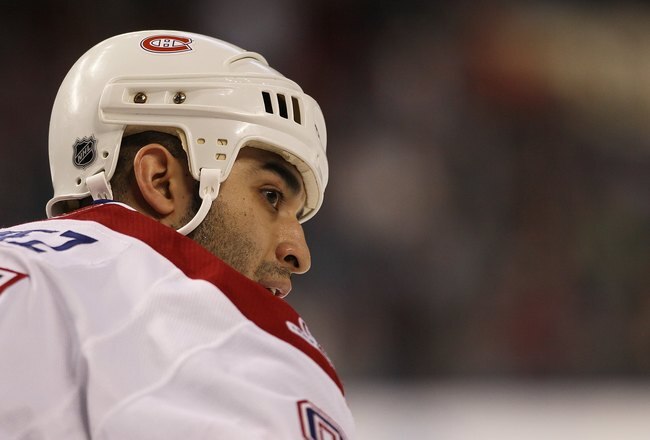 TAMPA, FL - JANUARY 27: Scotrt Gomez #91 of the Montreal Canadiens prepares to take a faceoff against the Tampa Bay Lightning at the St. Pete Times Forum on January 27, 2010 in Tampa, Florida.  (Photo by Bruce Bennett/Getty Images)