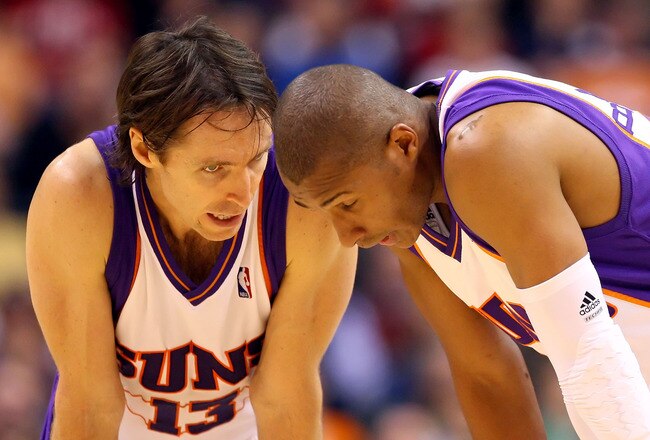 PHOENIX - DECEMBER 30:  Steve Nash #13 of the Phoenix Suns talks with Leandro Barbosa #10 during the NBA game against the Boston Celtics at US Airways Center on December 30, 2009 in Phoenix, Arizona. The Suns defeated the Celtics 116-98.  NOTE TO USER: User expressly acknowledges and agrees that, by downloading and or using this photograph, User is consenting to the terms and conditions of the Getty Images License Agreement.  (Photo by Christian Petersen/Getty Images)