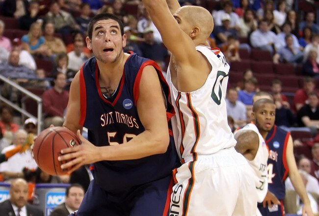 NORTH LITTLE ROCK, AR - MARCH 21:  Omar Samhan #50 of the Saint Mary's Gaels looks to shoot over Jimmy Graham #00 of the Miami Hurricanes during the first round of the South Regional as part of the 2008 NCAA Men's Basketball Tournament at Alltel Arena on March 21, 2008 in North Little Rock, Arkansas.  (Photo by Andy Lyons/Getty Images)