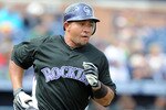 PEORIA, AZ - MARCH 08:  Miguel Olivo #21 of the Colorado Rockies runs the bases after hitting a two run homerun during a Spring Training game against the San Diego Padres on March 8, 2010 at Peoria Stadium in Peoria, Arizona.  (Photo by Lisa Blumenfeld/Getty Images)