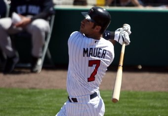 FORT MYERS, FL - MARCH 07:  Joe Mauer #7 of the Minnesota Twins hits against the New York Yankees at Lee County Sports Complex  on March 7, 2010 in Fort Myers, Florida.  (Photo by Marc Serota/Getty Images)