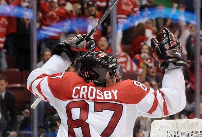 VANCOUVER, BC - FEBRUARY 28:  Sidney Crosby #87 of Canada skates around the net to celebrate after scoring the match-winning goal in the first overtime during the ice hockey men's gold medal game between USA and Canada on day 17 of the Vancouver 2010 Winter Olympics at Canada Hockey Place on February 28, 2010 in Vancouver, Canada.  (Photo by Harry How/Getty Images)