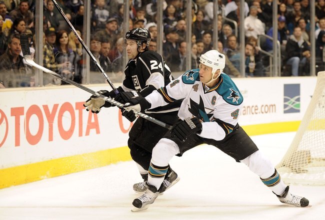 LOS ANGELES, CA - JANUARY 19:  Rob Blake #4 of the San Jose Sharks and Alexander Frolov #24 of the Los Angeles Kings battle for position during the game at Staples Center on January 19, 2010 in Los Angeles, California.  (Photo by Harry How/Getty Images)