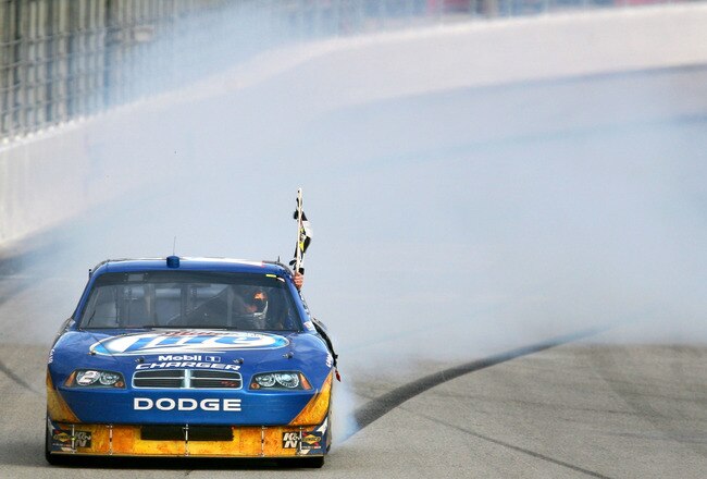 ATLANTA - MARCH 07:  Kurt Busch, driver of the #2 Miller Lite Dodge, does a burnout after winning the NASCAR Sprint Cup Series Kobalt Tools 500 at Atlanta Motor Speedway on March 7, 2010 in Hampton, Georgia.  (Photo by Chris Trotman/Getty Images)