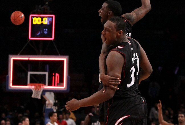 NEW YORK - MARCH 10:  Cashmere Wright #1 and Yancy Gates #34 of the Cincinnati Bearcats celebrate after defeating the Louisville Cardinals during the second round of 2010 NCAA Big East Tournament at Madison Square Garden on March 10, 2010 in New York City.  (Photo by Jim McIsaac/Getty Images)