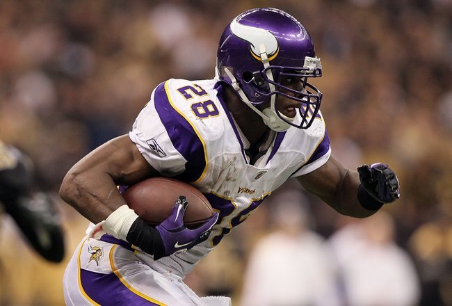NEW ORLEANS - JANUARY 24:  Adrian Peterson #28 of the Minnesota Vikings runs the ball against the New Orleans Saints during the NFC Championship Game at the Louisiana Superdome on January 24, 2010 in New Orleans, Louisiana.  (Photo by Jed Jacobsohn/Getty Images)