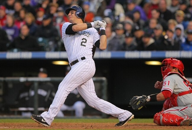 DENVER - OCTOBER 12:  Troy Tulowitzki #2 of the Colorado Rockies hits an RBI double in the bottom of the sixth to drive in Todd Helton #17 against the Philadelphia Phillies in Game Four of the NLDS during the 2009 MLB Playoffs at Coors Field on October 12, 2009 in Denver, Colorado.  (Photo by Doug Pensinger/Getty Images)
