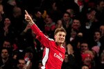 LONDON, ENGLAND - MARCH 09:  Nicklas Bendtner of Arsenal celebrates after scoring his team's second goal during the UEFA Champions League round of 16 match between Arsenal and FC Porto at the Emirates Stadium on March 9, 2010 in London, England.  (Photo by Mike Hewitt/Getty Images)