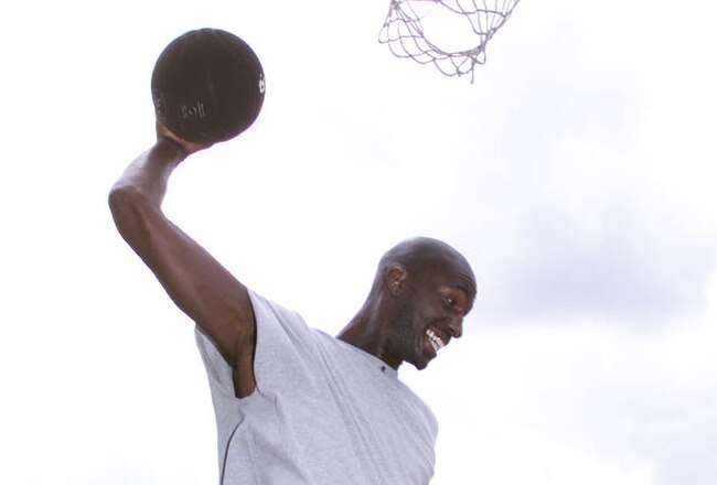 20 Jul 2001:  NBA and Olympic superstar Kevin Garnett and And 1 bring basketball to the UK at a clinic for London school children. +DIGITAL IMAGE+ Mandatory Credit: Clive Mason/ALLSPORT