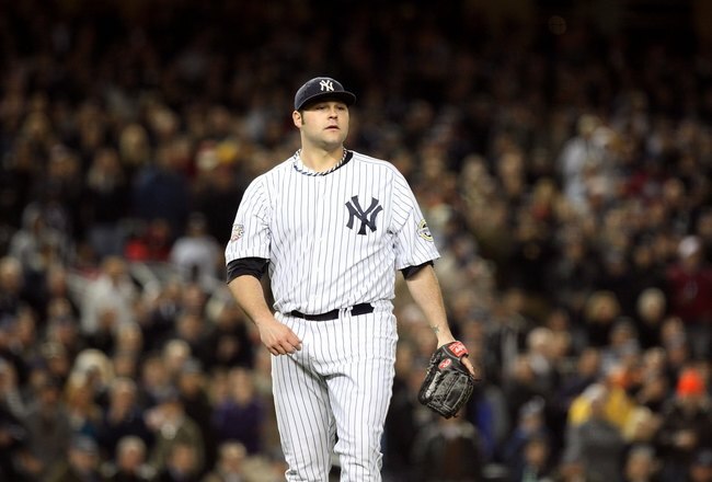 NEW YORK - NOVEMBER 04:  Joba Chamberlain #62 of the New York Yankees looks on against the Philadelphia Phillies in Game Six of the 2009 MLB World Series at Yankee Stadium on November 4, 2009 in the Bronx borough of New York City. The Yankees won 7-3 to win the series 4 games to 2. (Photo by Jed Jacobsohn/Getty Images)