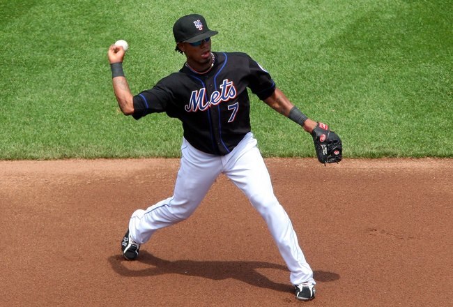 NEW YORK - MAY 13:  Jose Reyes #7 of the New York Mets throws to first against the Atlanta Braves on May 13, 2009 at Citi Field in the Flushing neighborhood of the Queens borough of New York City. The Braves defeated the Mets 8-7 in twelve innings.  (Photo by Jim McIsaac/Getty Images)